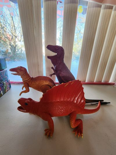 3 big size dinasor orange Edaphosaurus , a brown Spinosaurus, and Ankylosaurus