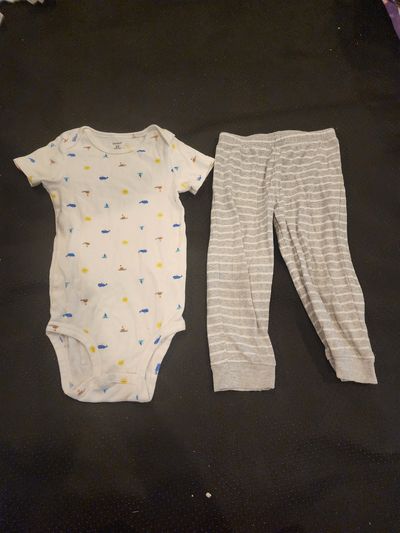Carter bodysuit patterned with sailboats and sunny yellow icons 24 Months
