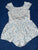 Btween White short sleeve romper with blue flowers 4T