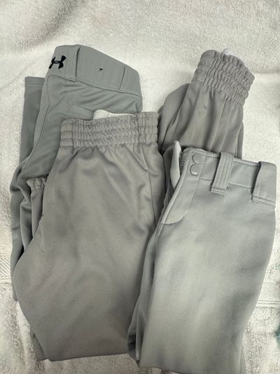 4 pairs of grey baseball/softball pants. YM & YL 4 pairs of grey baseball pants. YM & YL. Minor stains