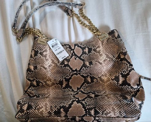 I.N.C. International Concepts New with tags. Purse and matching wallet. Gold chains and accents
