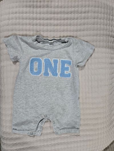 Amazon "One" romper listed as size 90 on tag 12 Months