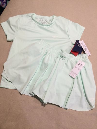 New with tags Reebok 2 pc set NWT Mint t shirt n flutter shorts 10-12