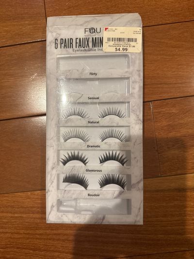 New 4 eyelashes but Opened and two were taken out And glue not there