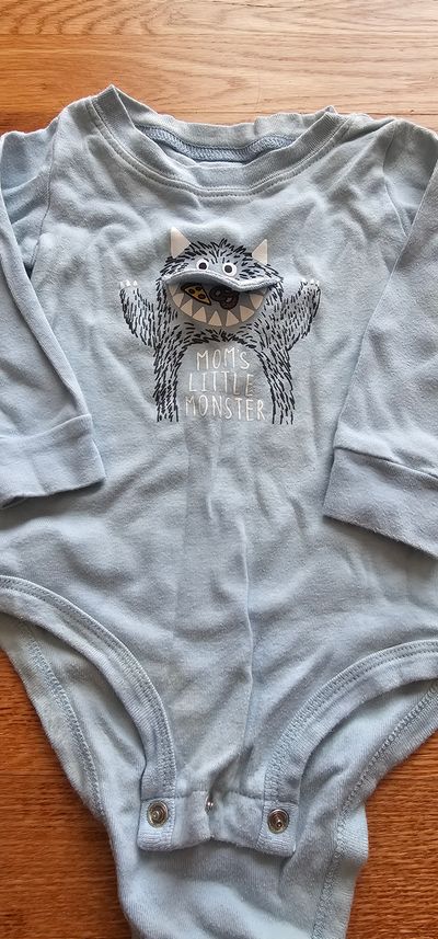 Carter's Like new graphic-cute monster long sleeves bodysuit in baby blue 12 Months