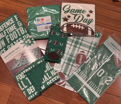 Brand new football themed six pieces. Two table Cloths, socks, napkin, dish drying mat