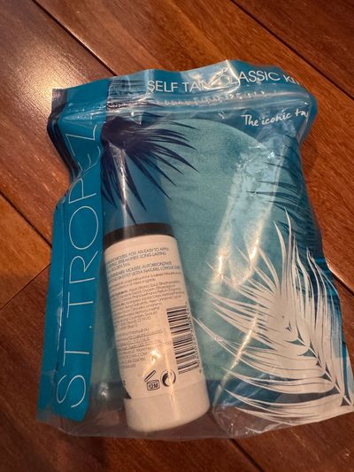Brand new ST Tropez self tanning lotion with mitt Retail $20Natural looking tan never opened from package