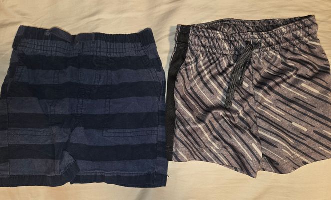 Set of 2 Boys Shorts 12M Dark blue is a stiffer material, gray one is like a sport short 12 Months