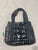 NA NEW Black puffer quilted tote, 2 side pockets, zipper top.