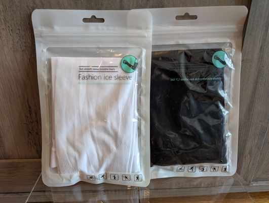 Unknown brand 2 new pairs of fashion ice sleeves - one black, one white