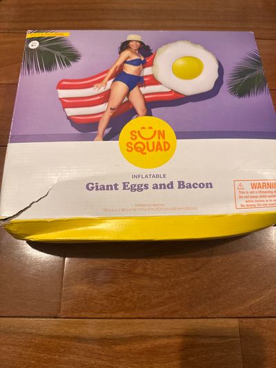 Brand new sun, squad, inflatable giant eggs and b Bacon from target box has a little tear in it as shown in picture