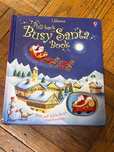 Pull back busy Santa book Santa drives on each pg Usborne