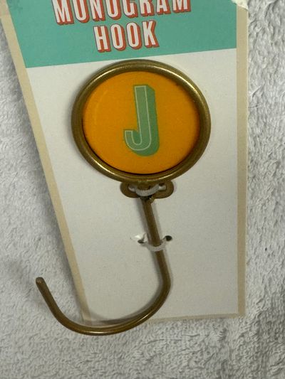 Monogram hook with letter J. Comes with screws Monogram hook with letter J. Comes with screws to hang
