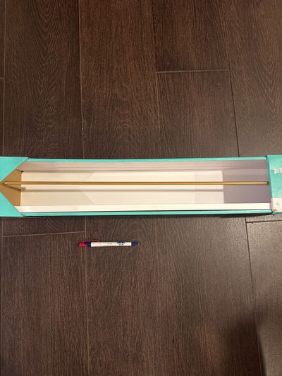 Brand new pillowfort wall shelf, 24 inches long By 4 1/2 wide color is white with a gold metal rail hold 12 lbs