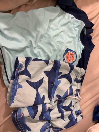 Carters Shark swim trunks size 5t and rash guard size 6- name stamp insid 5T/5