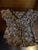 Wet Seal Brown short sleeve shirt with blue and tan flower design. Women's - S