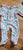 Nicole Miller New York Like new floral bodysuit with built-in footed coverage 6-9 Months
