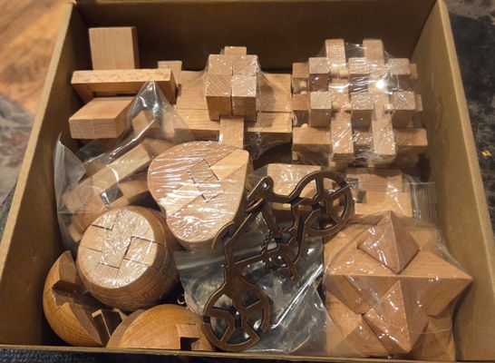 Brand new pack of 12 wooden puzzles