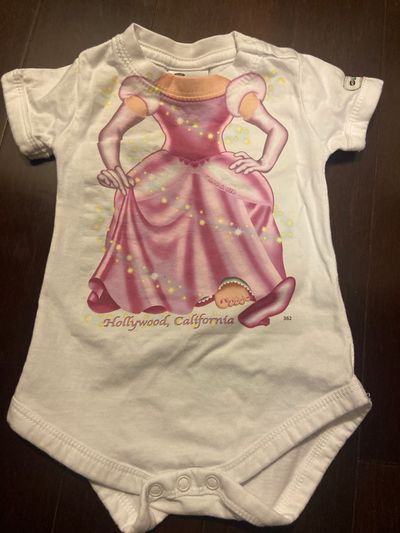 Just add a kid Size 6 months. Princess onesie 6 Months