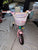 Rainbow 1.0 Pink and teal bike with basket and baby doll seat - missing 1 str 12 Kids Bike