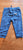 First Impression Like new graphic sweat pants w/ smile face prints on the back 24 Months