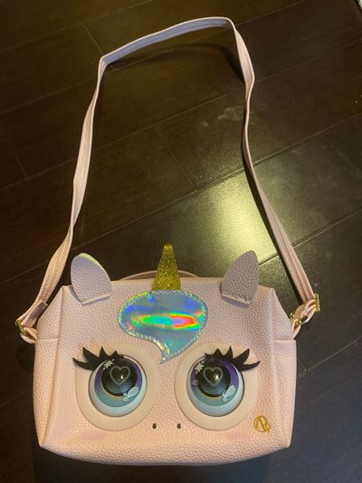 Purse pets Pink unicorn pocketbook Glamicorn. Blinks and laughs