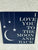 Home sign. Says I love you to the moon and back Home sign. Says I love you to the moon and back