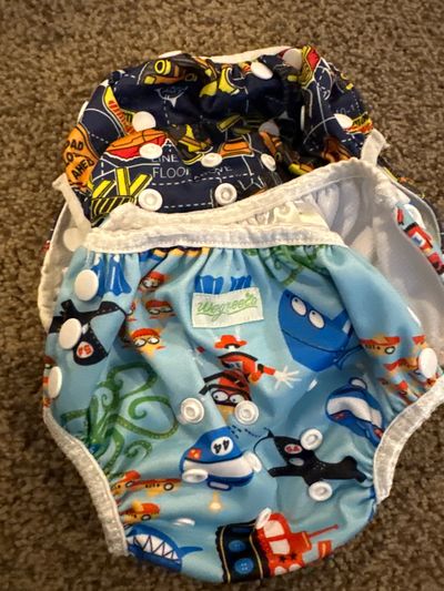 Two Swim diapers size small 0-8 months One dwave and one wegreeco