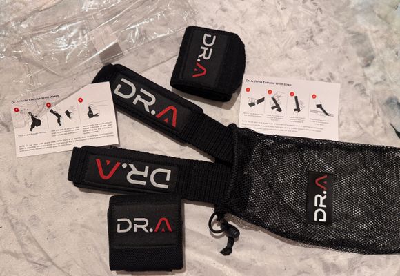 Brand new dr arthritis exercise wrist wrap & strap Comes with two of each and carrying case great for working out