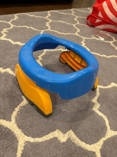 Pottete plus Foldable travel toilet / expandable potty seat over toilets
