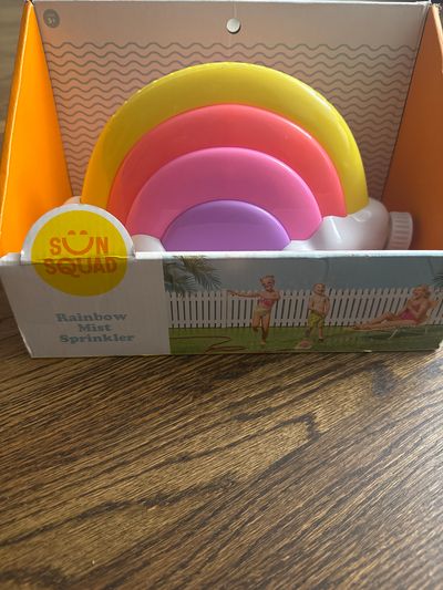 Brand new sun squad, rainbow mist sprinkler from Target attaches to standard garden hoses