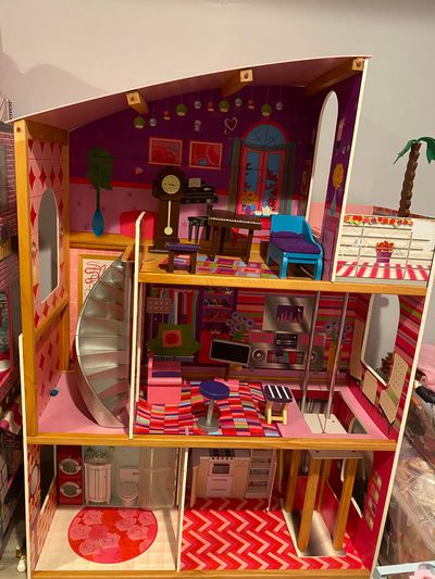 Barbie dollhouse 45 inches tall Barbie dollhouse. furniture includes. Small damage