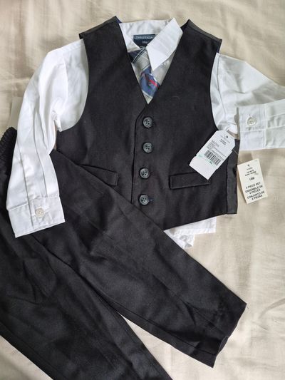 Nautica New with tags. Black suit with tie. Cotton and polyester 18 Months
