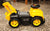 Mega Bloks CAT 3-in-1 ride-on toy. The steering wheel has controls that produce realistic truck soun