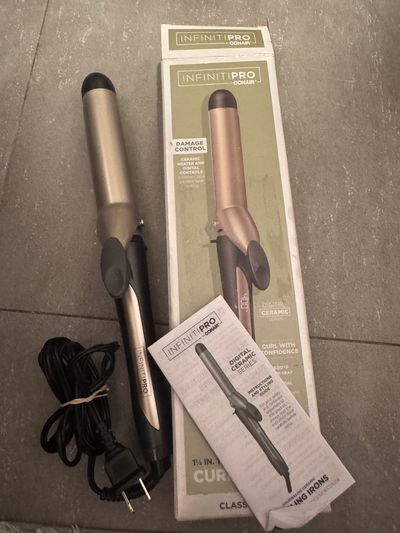 Brand new Infiniti pro by conair 1 1/4 curling iro Heats up to 400 damage control tested plugged in retail $32 plus