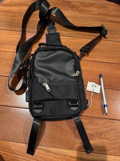 Brand new black multi purpose multi wear small Backpack pen for size lots of compartments and uses