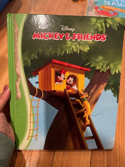 Disney Mickey & friends hard cover with small tear on cover
