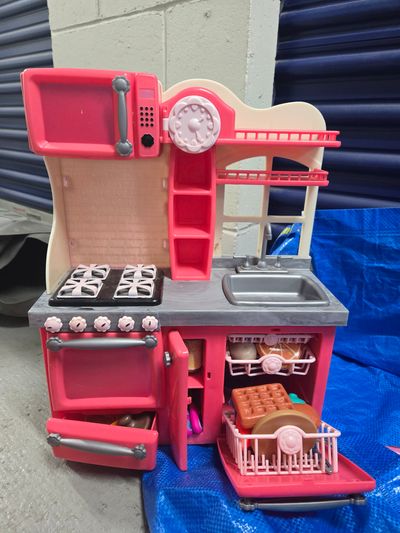 Our Generation Gourmet Kitchen Set for 18-inch dol play food, dishes, and kitchen utensils.
