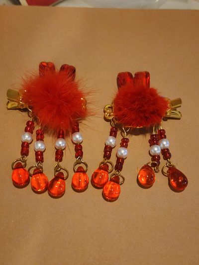Red hair clip balls and beaded tassels Red hair clip balls and beaded tassels